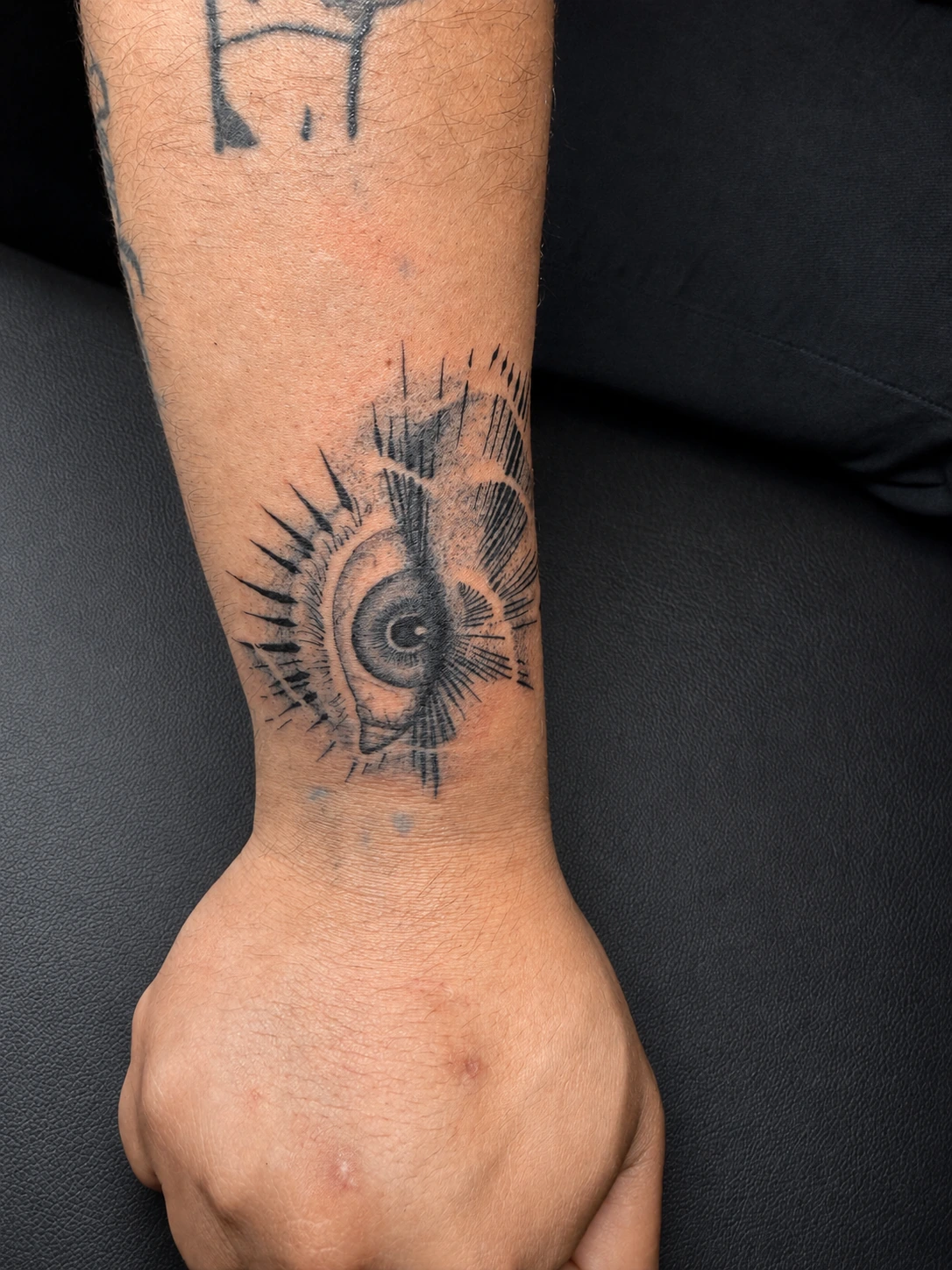 Black and grey eye tattoo